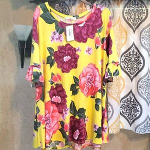 Floral top with ruffled trim sleeve. NWT